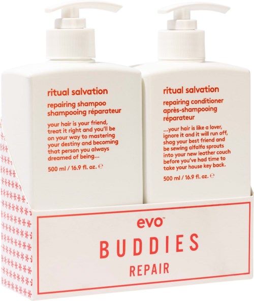 Two white bottles of hair care products with red and black text, labeled as reparative shampoo and conditioner.