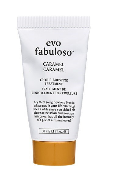 Eine weiße Tube mit goldener Kappe gekennzeichnet "evo fabuloso" für Haarkur, erwähnt Karamell und Farbstärkung.