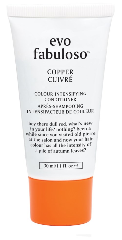 A white and orange tube of hair conditioner with black text, labeled evo fabuloso copper for color enhancement.