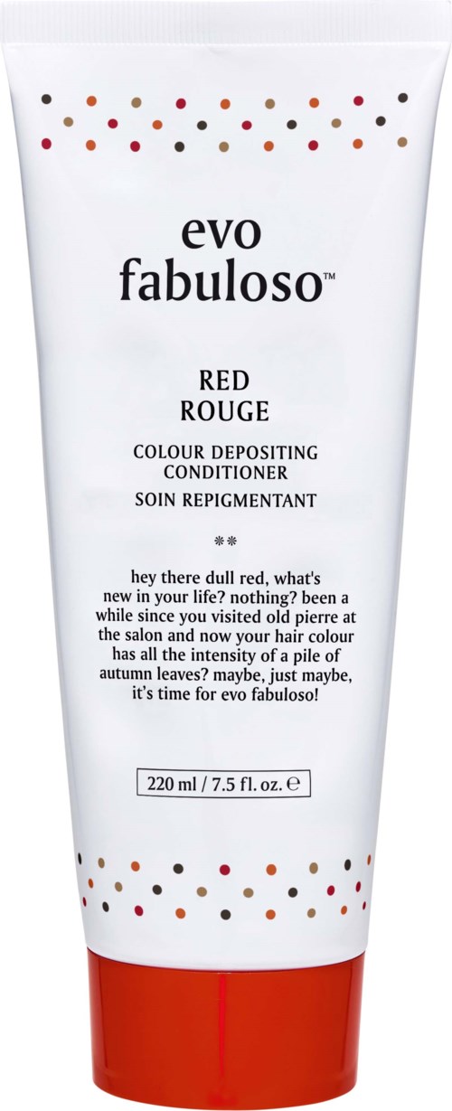 Eine weiße Tube mit roten und schwarzen Punkten, beschriftet 'evo fabuloso,' enthält farbgebenden Conditioner für rotes Haar.