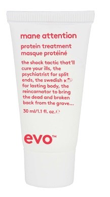 Eine weiße Tube Mane Attention Protein Behandlung mit rotem Text, beschreibt ihre Vorteile und Anwendung.
