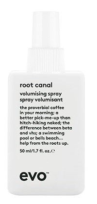 Eine weiße Flasche mit 'root canal' Beschriftung, enthält einen beschreibenden Text über Volumen-Spray mit Kaffee und Wurzeln.