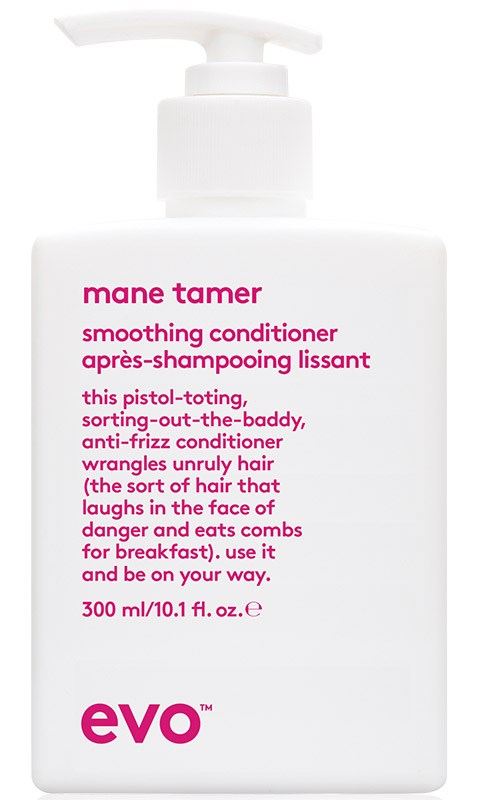 En vit flaska med pump, märkt "mane tamer" och "smoothing conditioner" i rosa text.