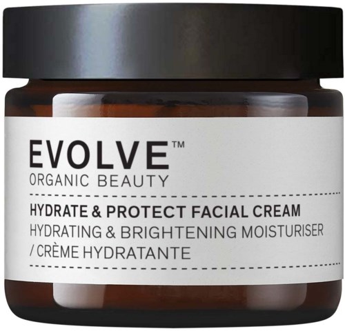 Ein brauner Behälter mit schwarzem Deckel, beschriftet 'Evolve Organic Beauty' Gesichtspflegecreme für Hydratation und Aufhellung.