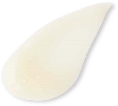 Ein cremiges, gebogenes Objekt mit spitzer Spitze, ähnelt einem Klecks Käse oder Creme.