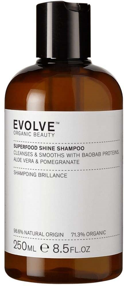 Brun flaska med Evolve Superfood Shine Shampoo, svart lock, vit etikett och produktdetaljer.