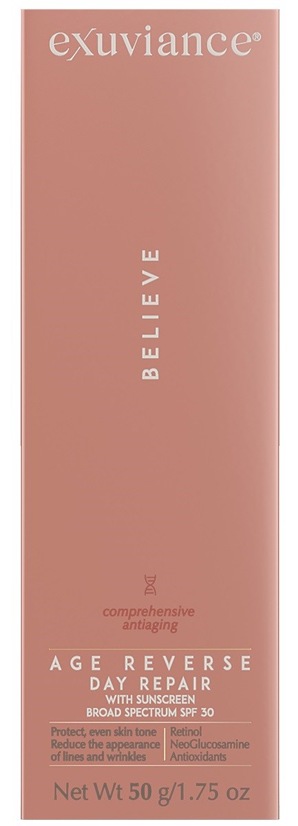 Eine rosafarbene Kosmetikbox mit weißen und kleinen Text, genannt 'exuviance,' 'BELIEVE,' und 'AGE REVERSE DAY REPAIR.'
