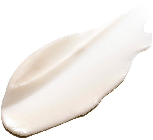 Ein Klecks weiße Creme oder Lotion auf weißem Hintergrund.