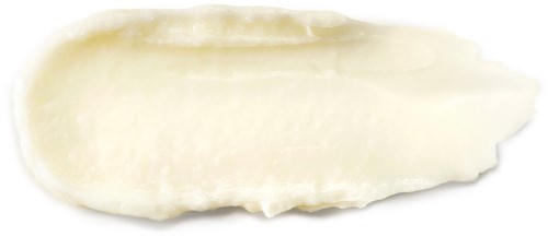 Eine weiße, cremige Substanz auf schwarzem Hintergrund, möglicherweise eine Kosmetik- oder Hautpflegecreme.