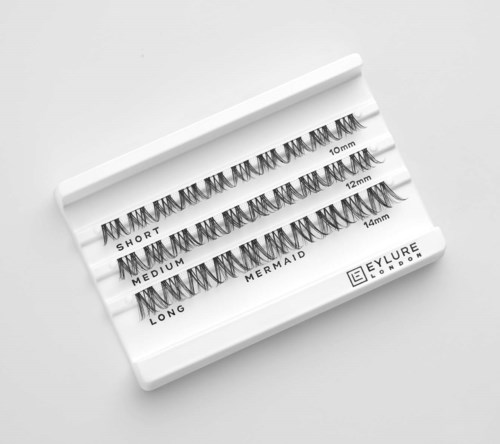 Four sets of false eyelashes labeled short, medium, mermaid, and long on a white case.