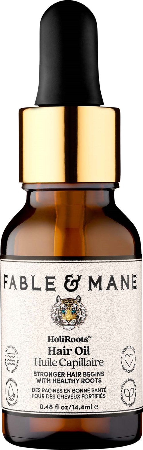 Fable & Mane hårolja i liten mörk glasflaska med svart pipettlock, etiketten visar produktinformation.