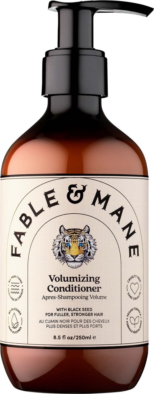 En brun flaska med pumpflöde märkt Fable & Mane Volumizing Conditioner med en tigerlogo. Passar för fylligare hår.