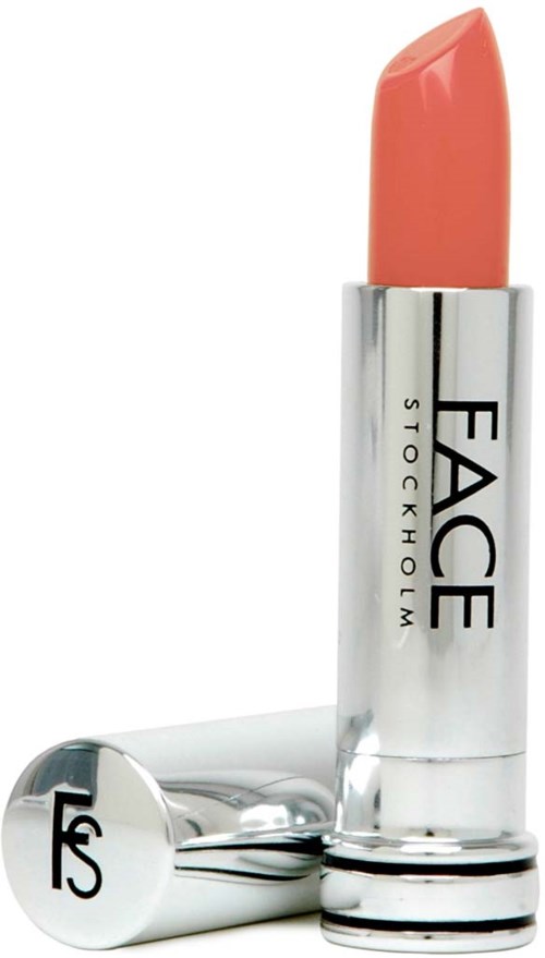 Lippenstift met label 'FACE STOCKHOLM' met perzikkleurige lipstick en zilveren huls.