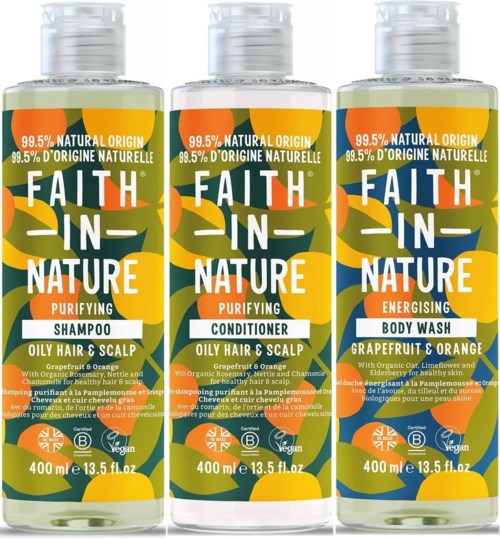 Three bottles of hair and body wash have orange, green, and white labels with lemon, orange, and leaf illustrations.