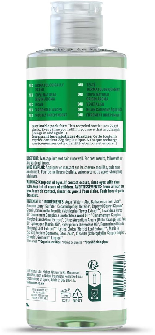 A transparent bottle with a green label, white cap, and black text, likely a personal care or cleaning product.