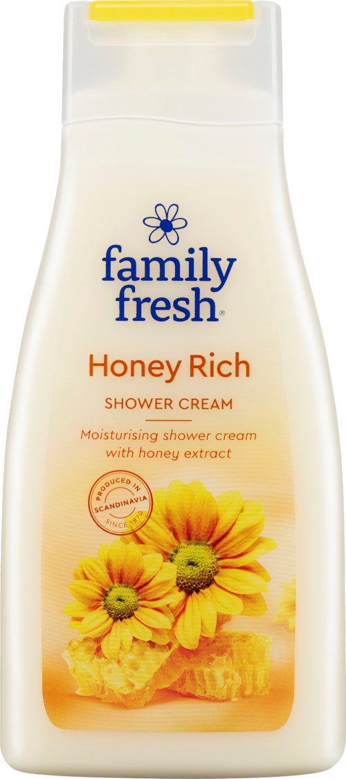 Suihkuvoide pullo on täynnä keltaisia kukkia ja hunajaa, sinisellä ja oranssilla tekstillä, merkinnällä "Family Fresh Honey Rich."