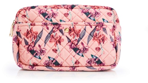 A pink quilted bag with a floral pattern and multiple zippers.