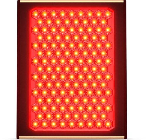 A red LED light panel with many glowing yellow-orange lights arranged in a honeycomb pattern.