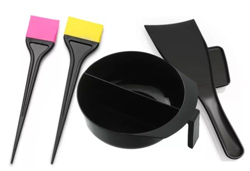 Tools for cleaning or applying substances, including two brushes, a black bowl, and a spatula.