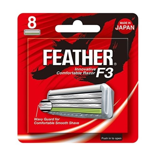 Roze en zwarte verpakking van Feather F3 scheermesnuizen met zilveren scheermes en tekst.