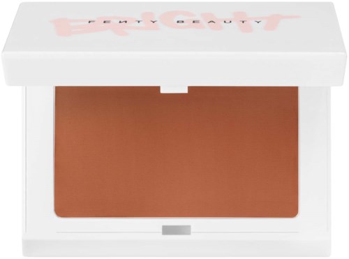 A makeup blush in a white box with a clear lid and pink text, showing a shade of brownish pink.