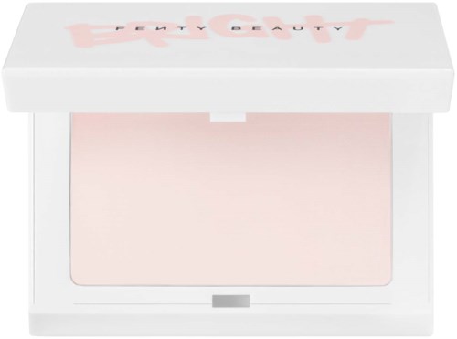 A makeup compact with a light pink powder inside, in a white box with pink text on the lid.