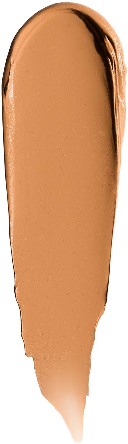 A swatch of beige makeup or foundation with darker edges on a white background.