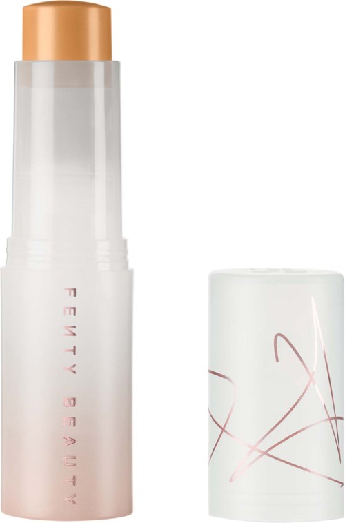 A white cosmetic bottle with a gold cap and a white container with red lines design.