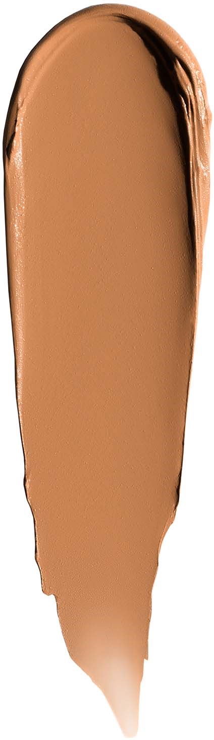 A swatch of light brown makeup or foundation with a darker streak on the right side.