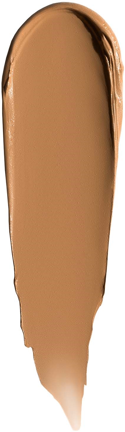 A swatch of beige makeup or foundation with a small tip at the bottom.