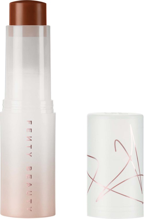 A white bottle with a brown cap, label reads 'FEMME REVIEW', with a separate white cap decorated with red lines.