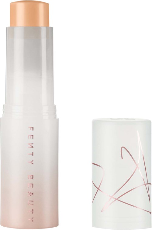 A skincare product in a tall white bottle with a beige cap and pink writing, next to a small white container with pink lines.