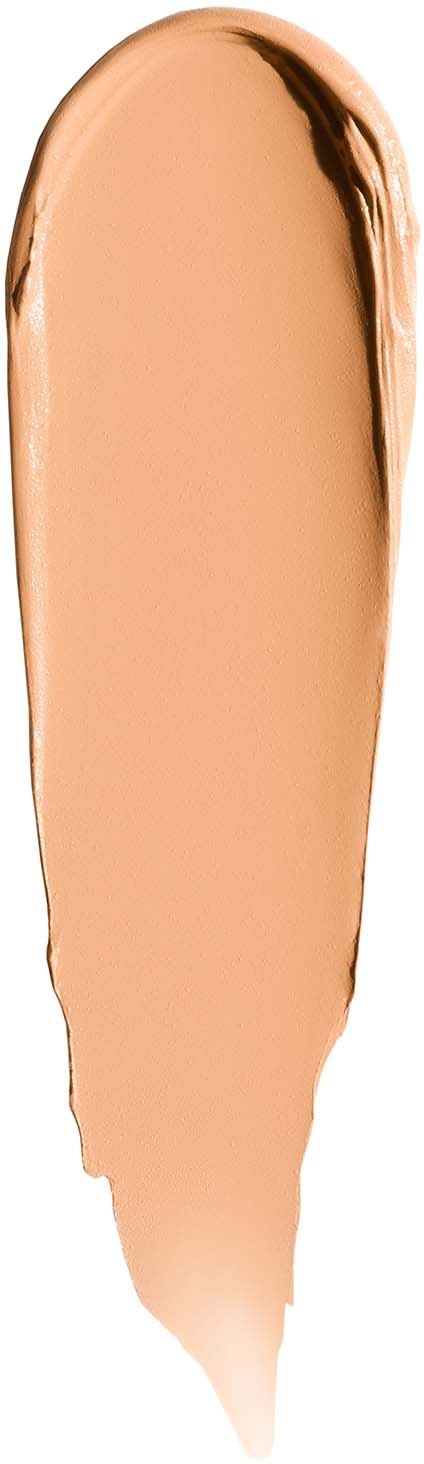 A smear of beige makeup with darker edges, elongated and curved in shape.