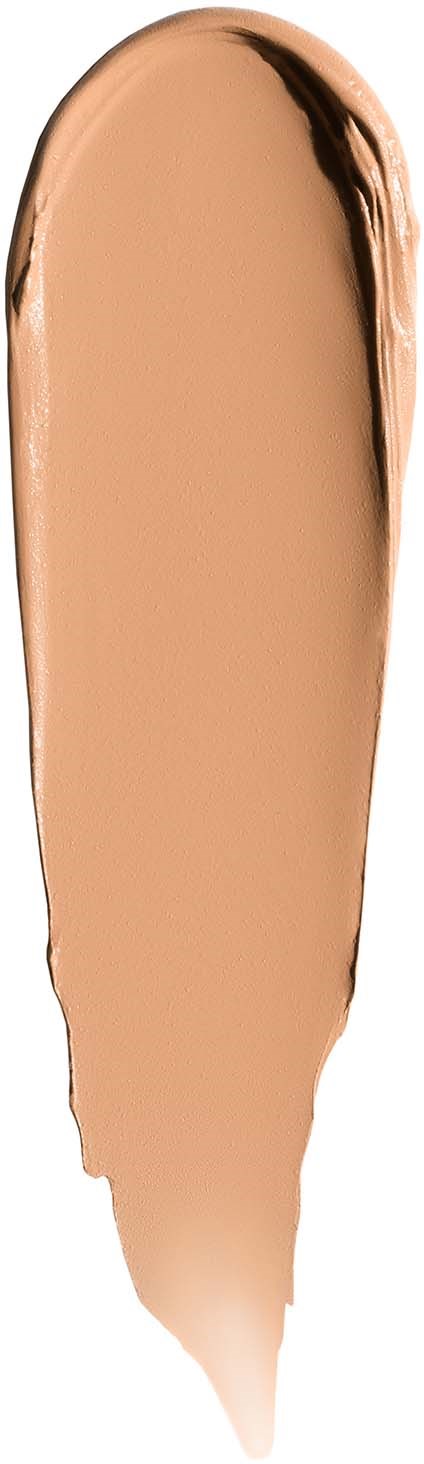 A smear of beige foundation with darker shades at the edges on a vertical background.