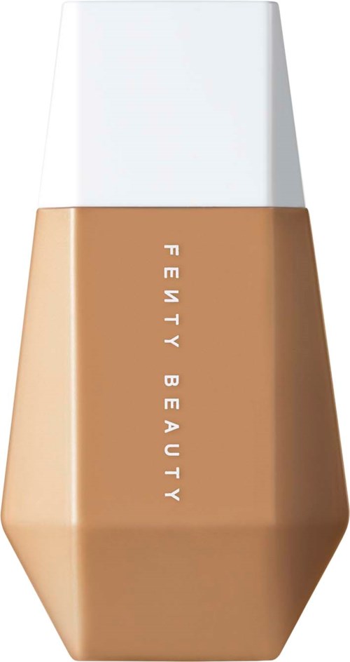 A foundation bottle with a white cap and beige liquid inside from Fenty Beauty.