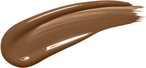 A streak of brown makeup or paint on a black background.