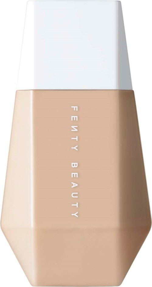 A beige bottle labeled 'Fenty Beauty' with a white cap, likely a cosmetic product.