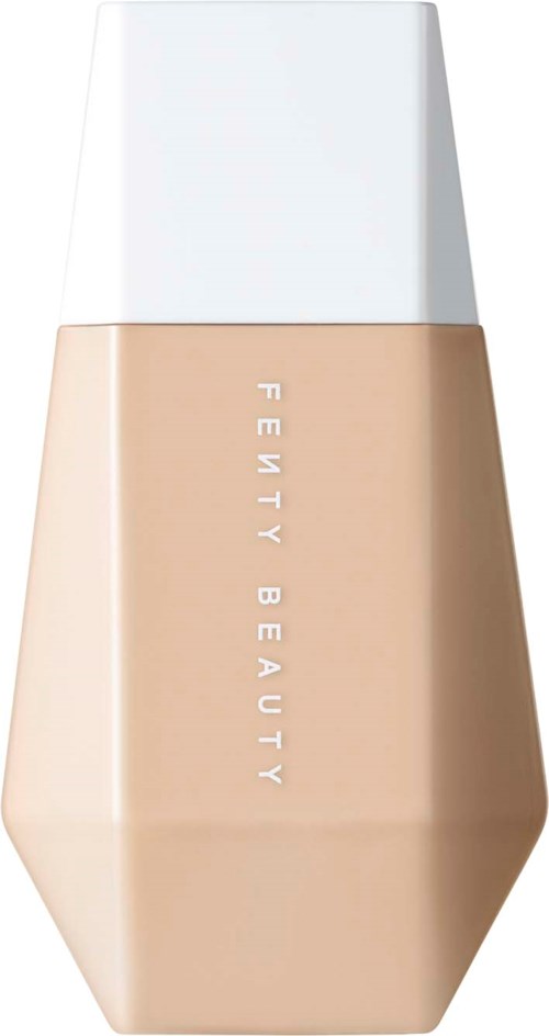 A beige bottle with a white cap, labeled 'FENTY BEAUTY', possibly makeup or skincare product.
