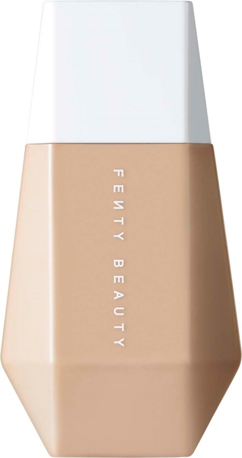 A beige liquid foundation bottle with a white cap, name 'Fenty Beauty' written vertically on it.