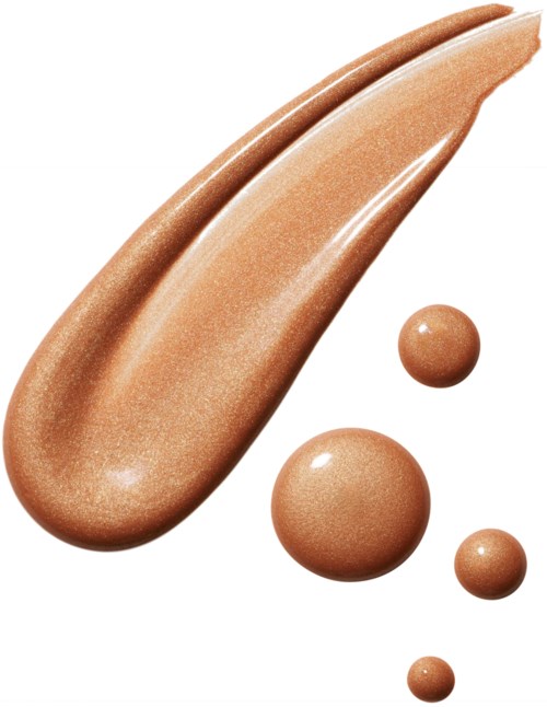 A droplet of beige or tan liquid with four smaller droplets around it.