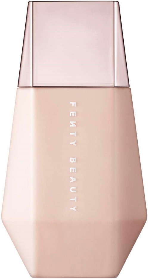 A beige bottle with a pink cap, labeled 'FEMMY BEAUTY', likely a cosmetic product.