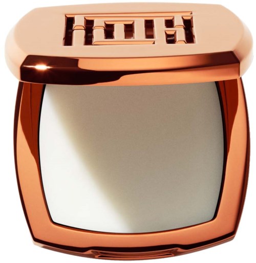 A rose gold compact with a mirror on the bottom and a logo or design on top.