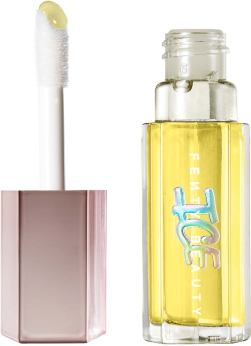 Lip gloss with a white applicator and a transparent yellow bottle. The bottle has a colorful logo. The background is white.