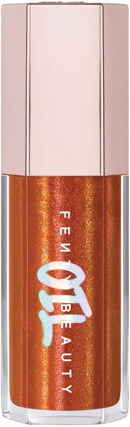 A tube of orange-brown shiny lip gloss with a beige cap from Fenty Beauty.