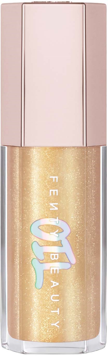 A tube of liquid highlight with a pink cap and gold-colored shimmer, branded as FEM BEAUTY.