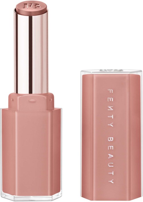 Lipstick with a pinkish matte finish, open revealing a light pink bullet, and a matching cap beside it.