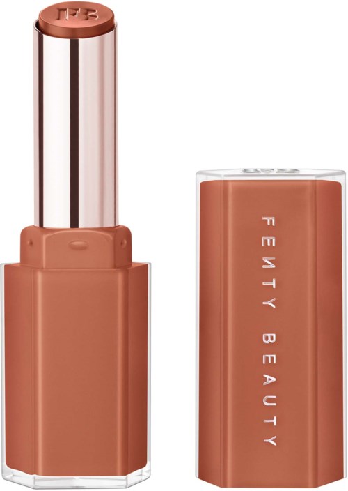 A lipstick with a brownish shade, the cap is removed showing the product inside.
