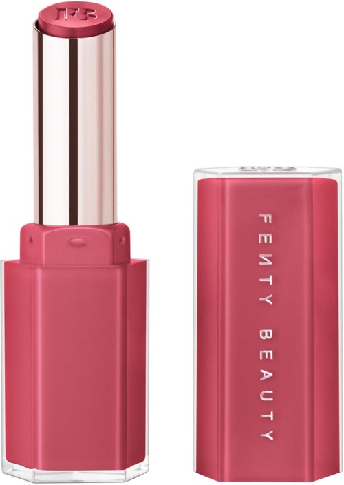 A pink lipstick with a silver middle section and a clear pink cap from Fenty Beauty.