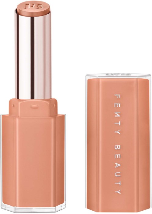 A lipstick with a beige cap and matching body, showing the brand name in silver letters.