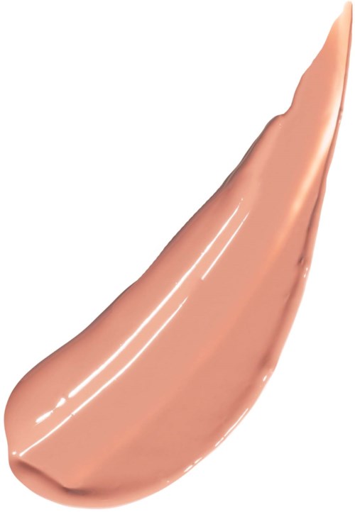 A dollop of beige-colored liquid makeup or foundation with a shiny appearance.